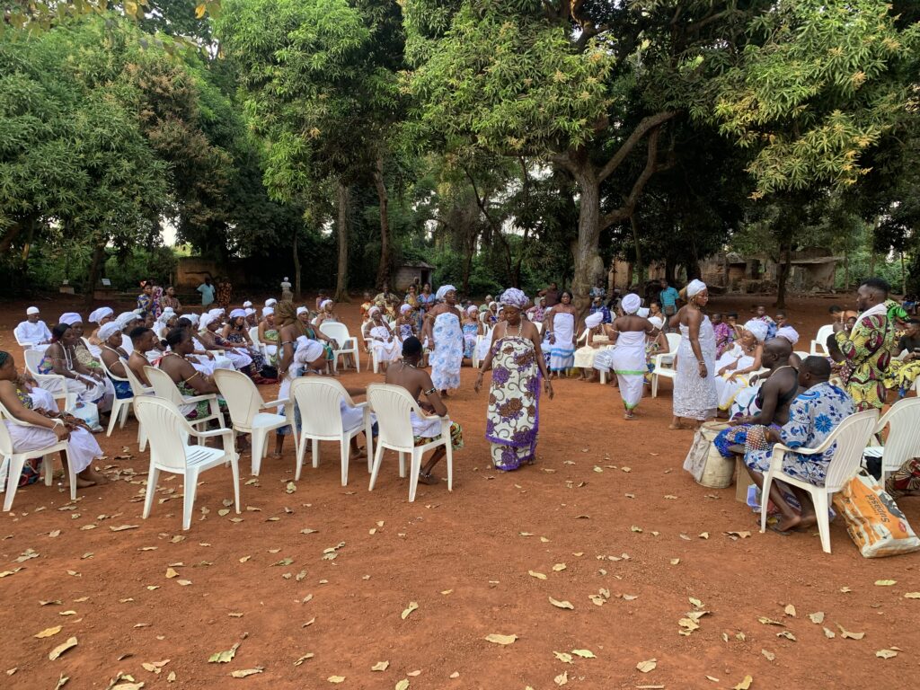 Assembly of Vodun adepts dressed in white during a ceremony, Benin, January 2026