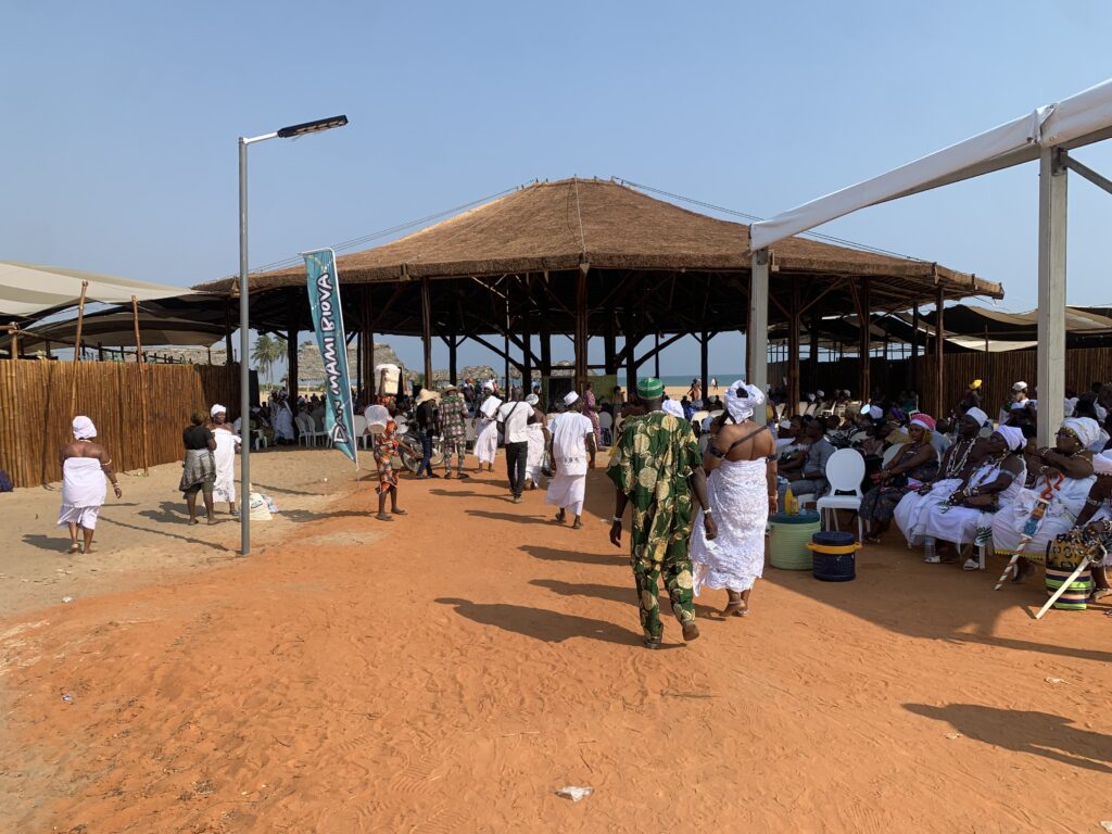 Adepts in white on one of the ceremonial squares of Ouidah, Vodun Days 2026